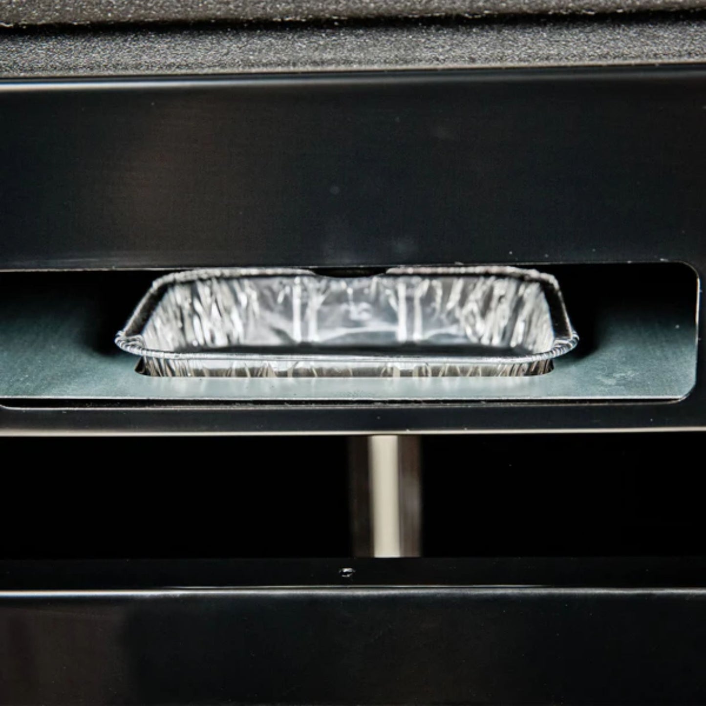 Aluminum foil pan inside an oven