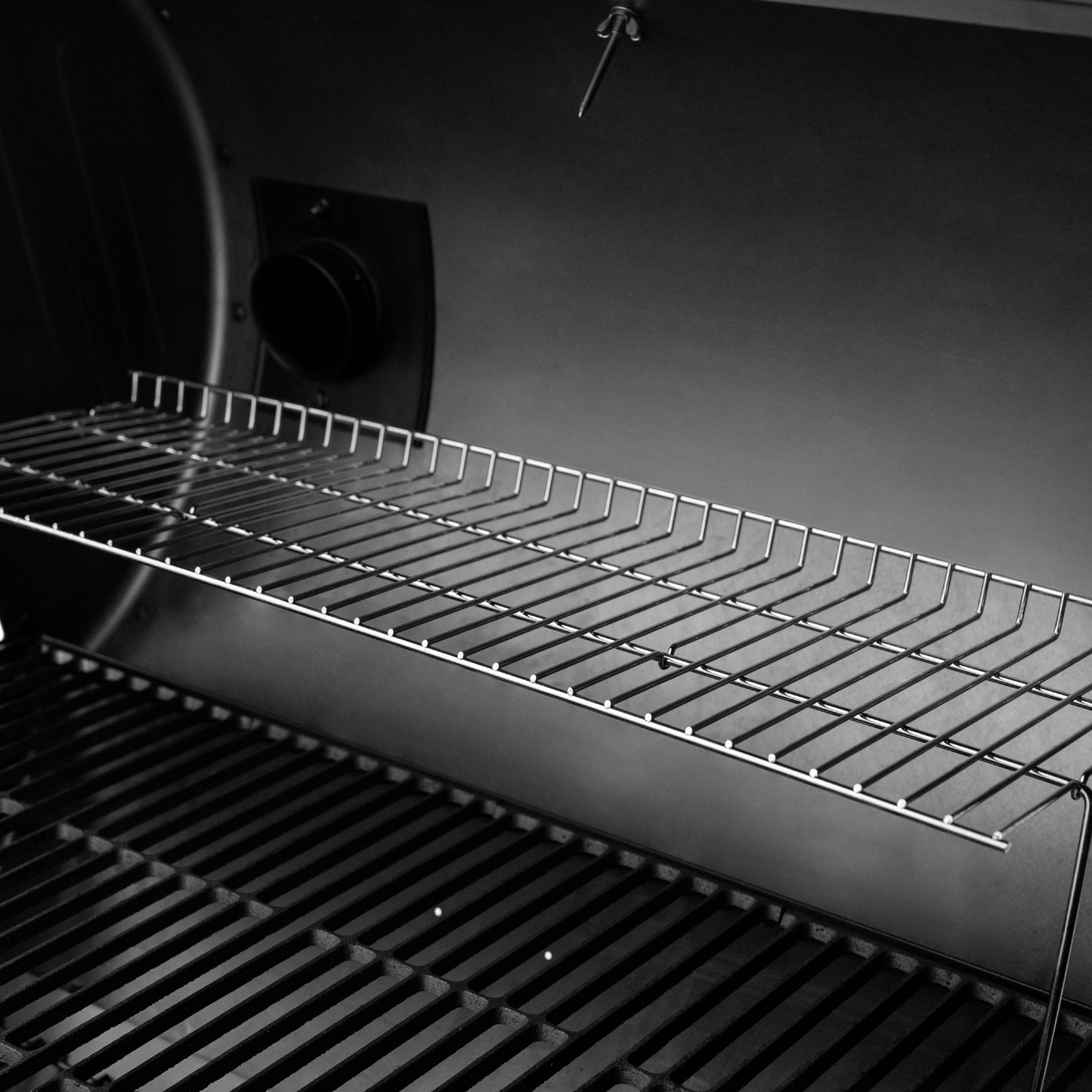 Steel rack inside BBQ grill.