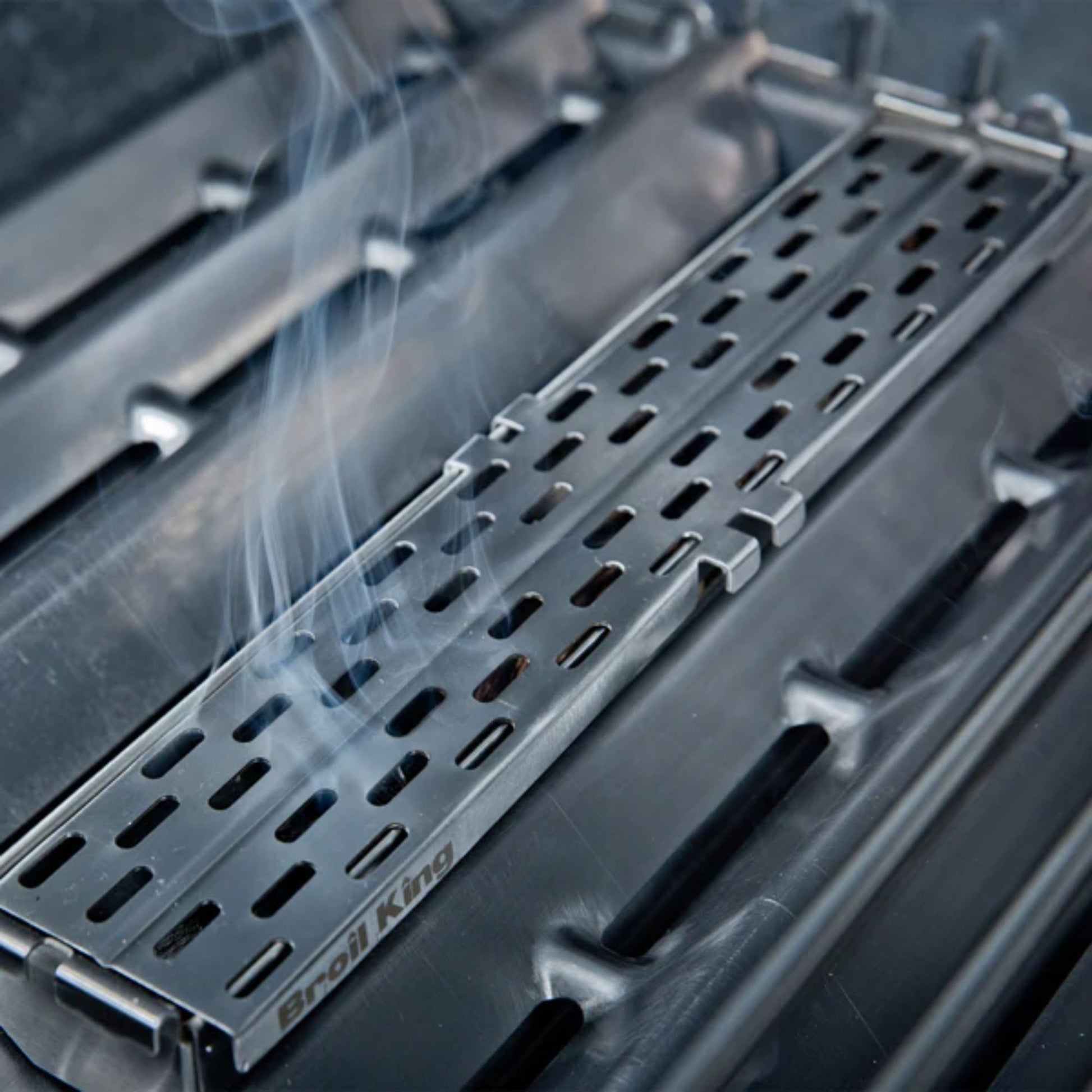 Metal grill rack with 'Broil King' branding on a blurred background