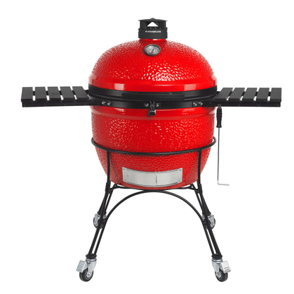 Red ceramic barbecue grill on a white background