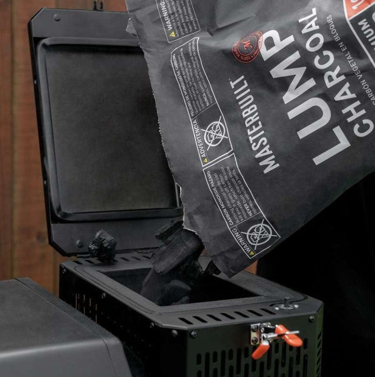 Bag of Masterbuilt lump charcoal being used with a grill
