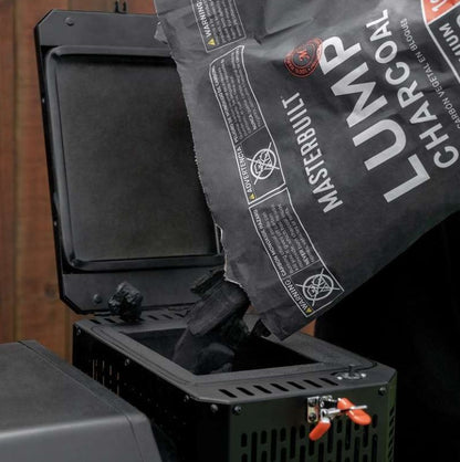 Bag of Masterbuilt lump charcoal being used with a grill