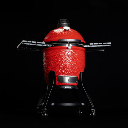 Kamadoe Joe BBQ with stand on a black background.