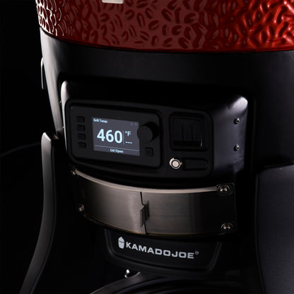 Close-up of a Kamado Joe grill with digital temperature display on a black background
