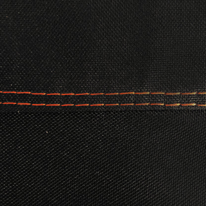 Close-up of black fabric with red stitching detail