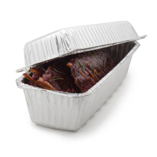 Aluminum foil container with roasted meat on a white background