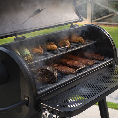 Barbecue grill with food cooking on a patio