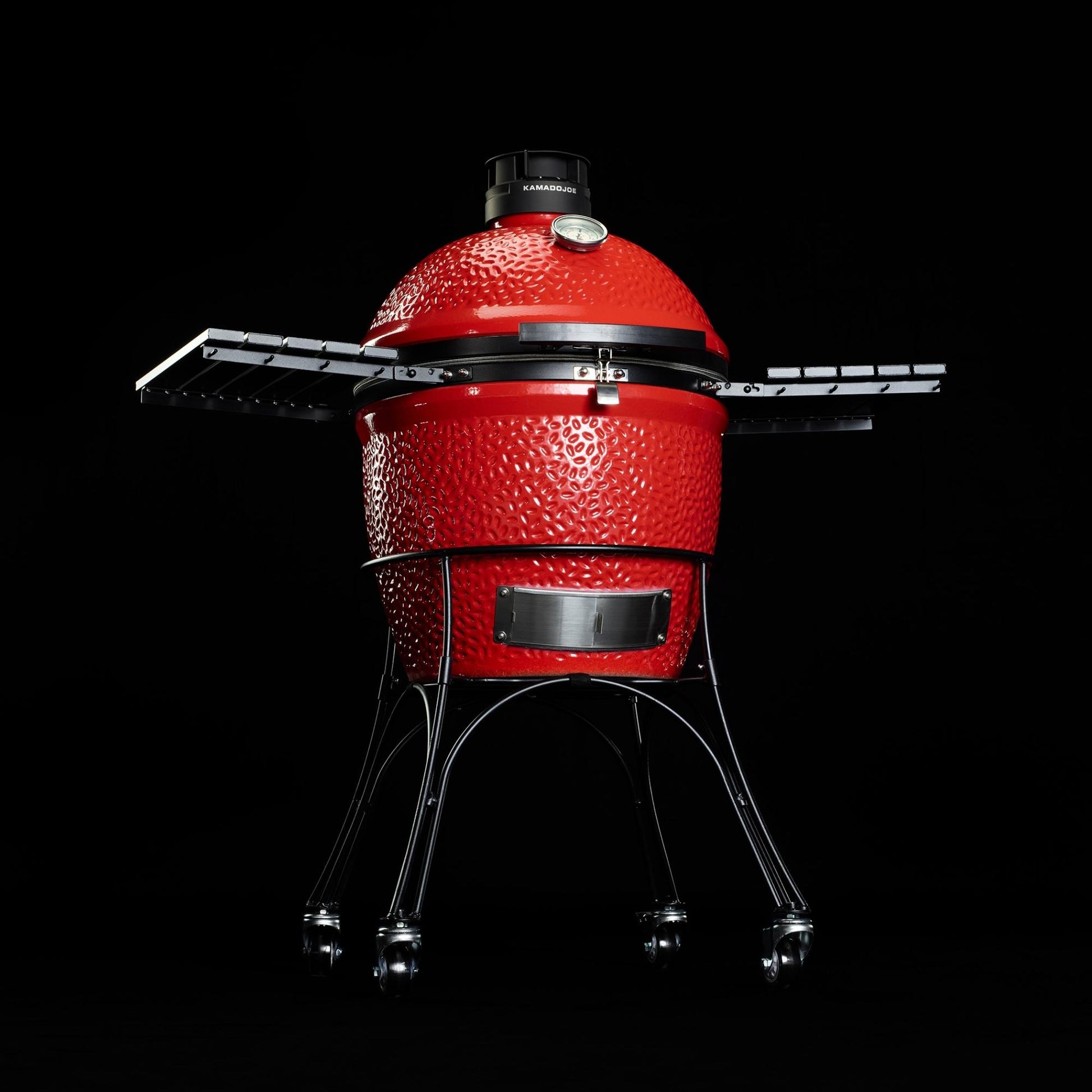 Red barbecue grill on a black background