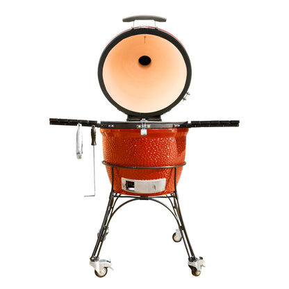 Kamadoe Joe BBQ grill with the lid open on a white background