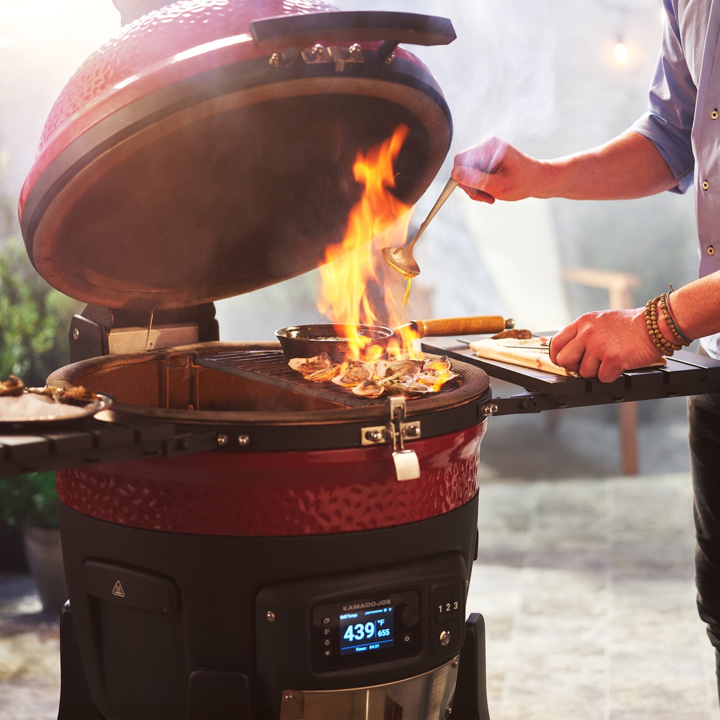 Konnect Joe BBQ with flames coming from the grill. 