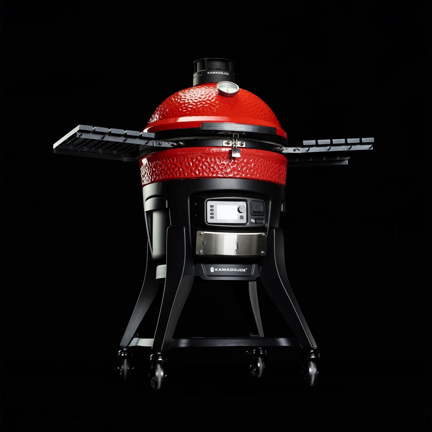 Red Kamado-style grill on a black background