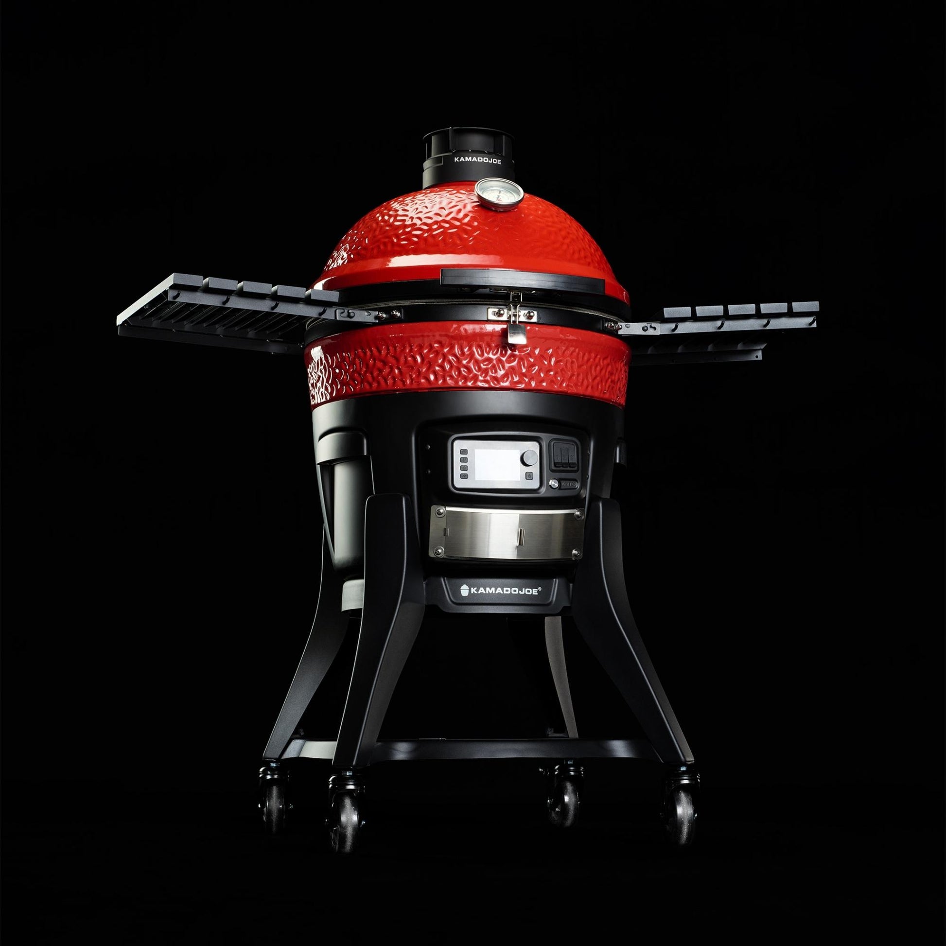Red Kamado-style grill on a black background