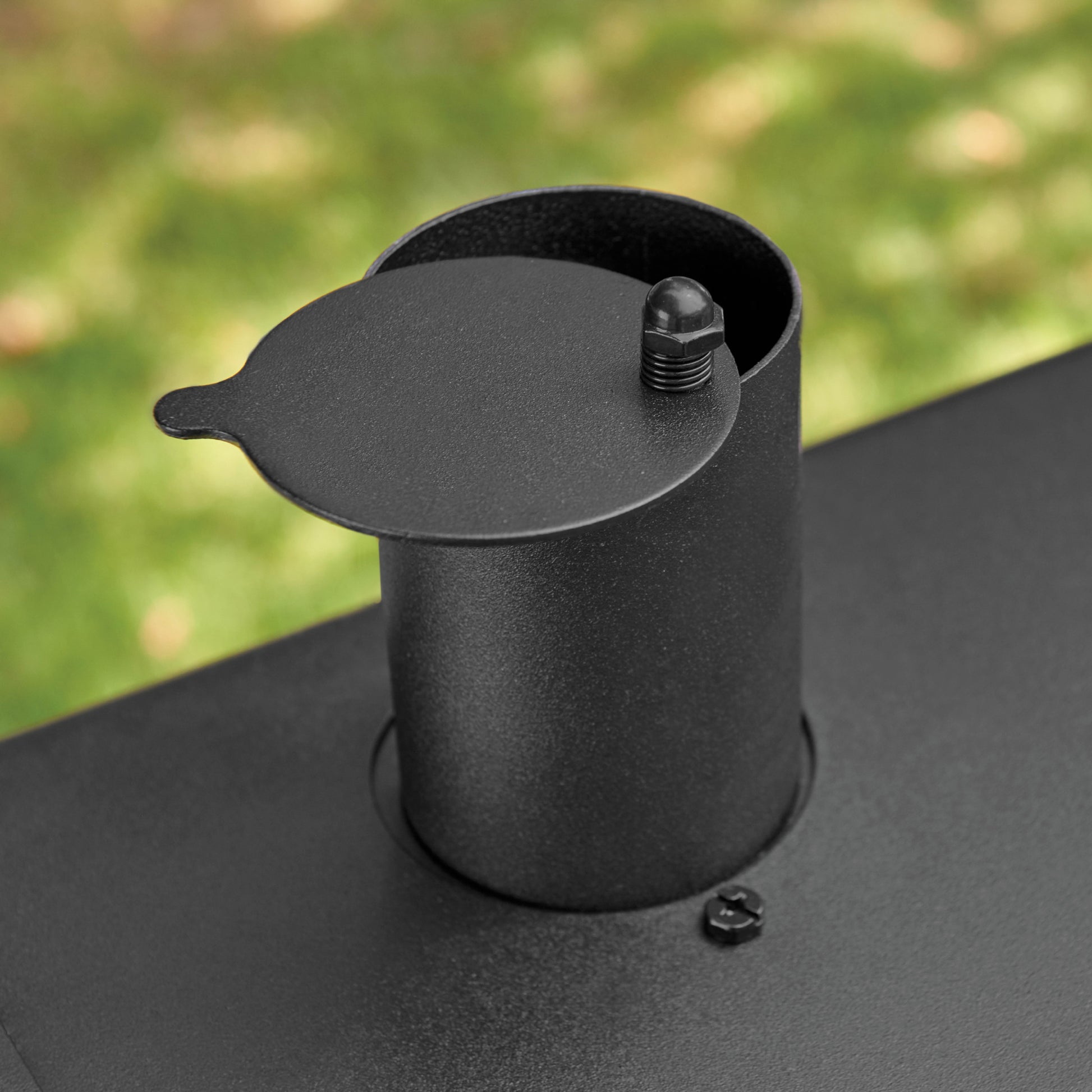 Smoke stack on the top of Char-Griller traditional grill.